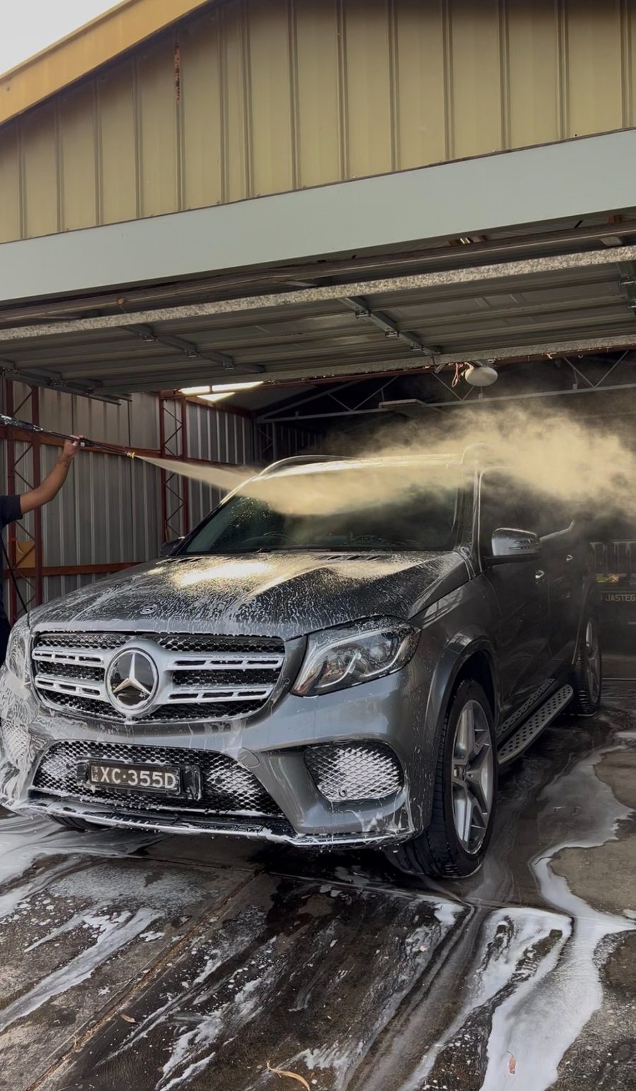 Mercedes GLS covered in snow foam during decontamination wash
